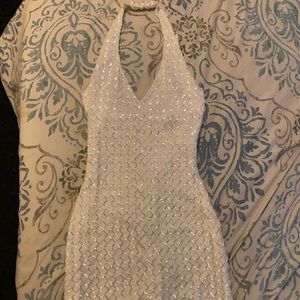 White halter dress with silver sequins.